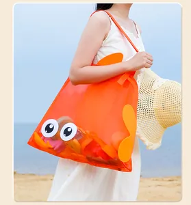 Large orange fish mesh beach bag for children's toy storage in outdoor travel scene