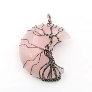 Detailed view of handmade copper wire Tree of Life on rose quartz crescent pendant