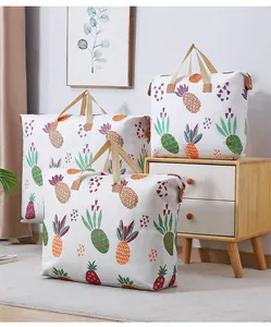 Lifestyle scene showing large pineapple print storage bags for quilt and clothes organization
