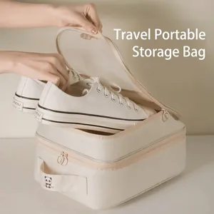 Portable beige travel shoe storage bag for organizing sneakers and dustproof footwear.