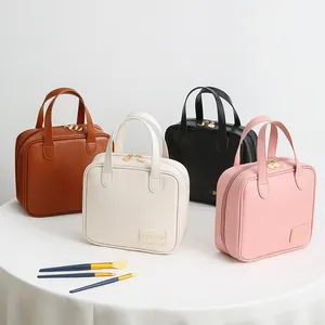 Detailed view of portable PU leather cosmetic bags in various colors with brushes