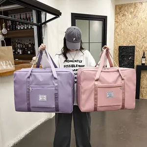 Durable large capacity waterproof travel storage bags in purple and pink colors