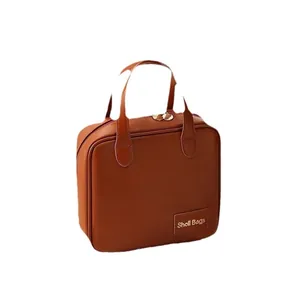 Professional portable brown PU leather makeup bag with handle and secure zipper closure