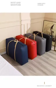 Large capacity quilt storage bags in four colors arranged in a modern bedroom corner.