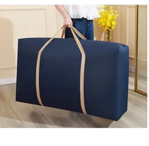 Detailed view of the large navy blue moving storage bag being held by a reinforced handle