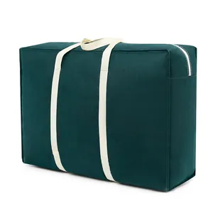 Large dark green quilt storage bag with sturdy white handles for household moving
