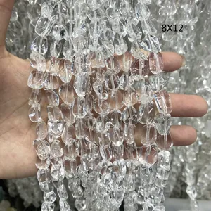 Macro detail of natural Brazilian clear quartz irregular faceted loose beads 8x12mm.