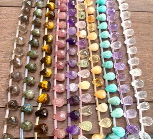 Various colors of faceted natural crystal teardrop beads for DIY jewelry making projects.