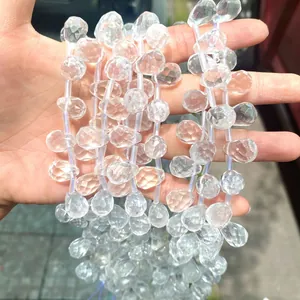 Detail view of faceted clear natural crystal teardrop beads for DIY jewelry making crafts