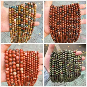 Detailed textures of natural stone round beads including Dragon Blood stone and Jasper