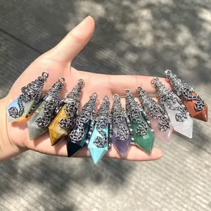 Detail showing a collection of hexagonal crystal pendants with vintage bat wing metal caps.