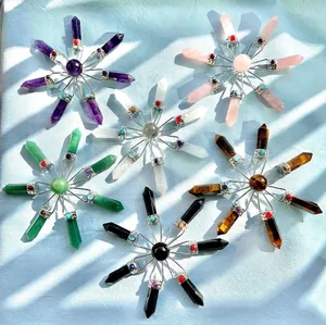 Detailed view of six natural crystal stone snowflake-shaped pendulums with hexagonal points