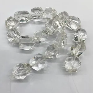 Macro view of natural clear quartz faceted irregular beads for DIY jewelry making