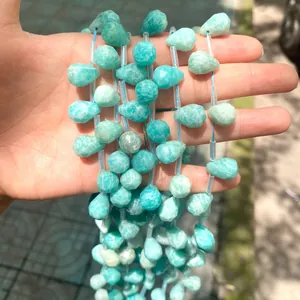 Close-up of faceted teardrop natural amazonite crystal beads for DIY jewelry making