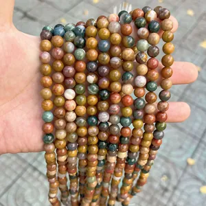 Detailed close-up of multi-colored natural stone round beads for DIY jewelry making