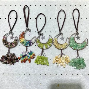 Detailed view of five hand-woven moon ornaments with various natural crystals.
