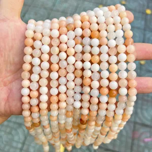 Detail shot of peach and white natural stone round beads for DIY jewelry