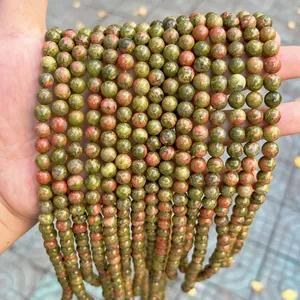 Close-up of natural Dragon Blood Jasper round stone beads for DIY jewelry making projects