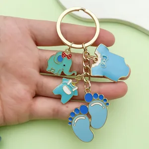 Close-up of cute blue enamel baby theme keychain with elephant and footprint charms