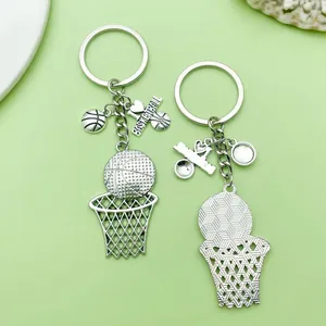 Detailed view of alloy basketball hoop keychains showing front and back textures