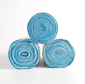 Close-up showing three rolls of thickened blue patterned drawstring garbage bags for kitchen