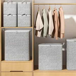 Grey herringbone fabric storage boxes for closet clothes and bedding organization