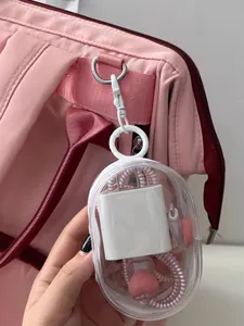 Portable transparent cable organizer pouch showing charger storage on a pink backpack