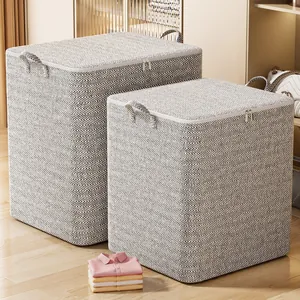Two grey and white herringbone pattern fabric storage bins for clothes and bedding