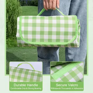 Portable green checkered waterproof picnic mat with a durable handle for outdoor camping