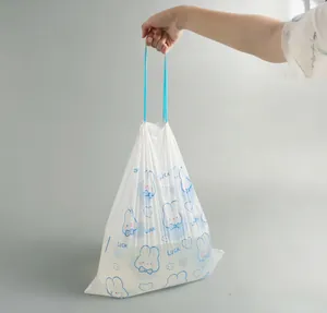 Detailed view of white drawstring garbage bag with cute blue rabbit and heart prints