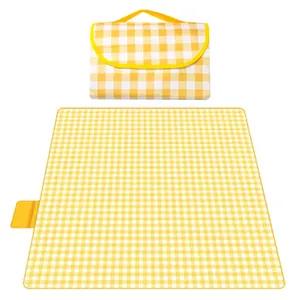 Portable waterproof yellow checkered picnic mat for outdoor camping and beach use