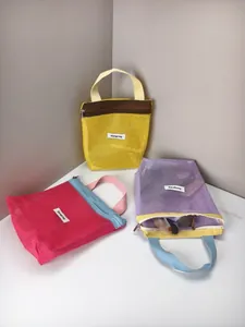 Three colorful mesh storage bags with "Storage bag" label in a minimalist setting