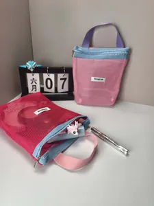 Close-up of contrast mesh storage bags with dopamine colors and portable handles