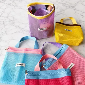 Vibrant mesh cosmetic bags in contrasting colors for summer storage and travel.