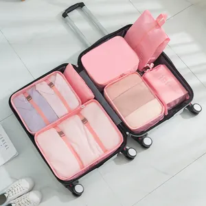 7-piece pink travel organizer bag set for suitcase storage featuring mesh design and zippers