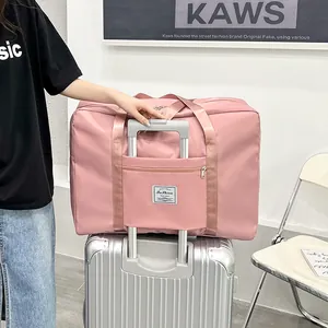 Extra large capacity pink travel duffel bag with luggage trolley sleeve for easy packing