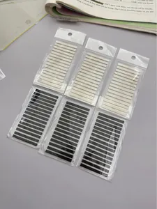 Detailed view of ultra-fine waterproof PET index tabs in black and white packs for study.