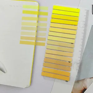 Detail showing ultra-thin yellow gradient PET transparent index stickers on a notebook