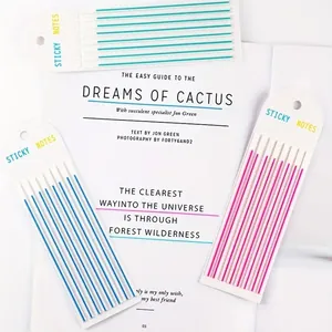 Close-up detail of colorful long PET index sticky notes used for underlining text in a book.