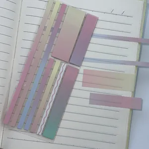 Close-up of pastel gradient transparent index tabs applied to a lined notebook page