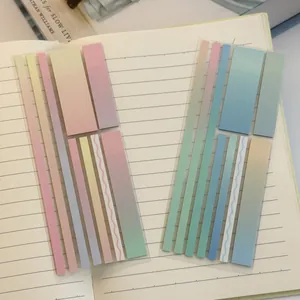 Detailed macro view of colorful gradient transparent index tabs on a lined notebook page