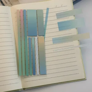 Detail shot of transparent gradient index stickers on notebook pages