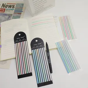 Vue détaillée des languettes d'index adhésives transparentes dégradées sur un carnet