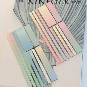 Macro detail of gradient pastel index stickers on a stylish magazine lifestyle background