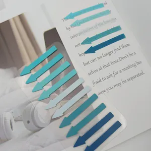 Close-up detail of translucent Morandi arrow index stickers applied to a printed page