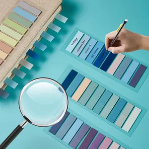 Macro detail of 60-color transparent waterproof sticky index tabs used in a planner