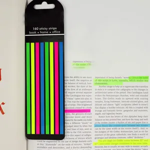 Detailed view of semi-transparent colorful index tabs highlighting text in a book.