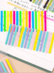 Detailed view of colorful translucent index tabs used as page markers in a notebook