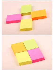 Macro view of colorful neon sticky notes in pink, green, orange, and yellow hues