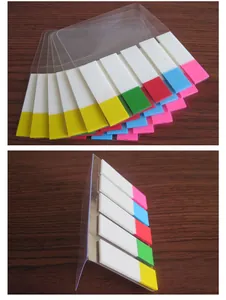 Close-up detail of colorful PET index tabs with transparent plastic backing on wooden desk